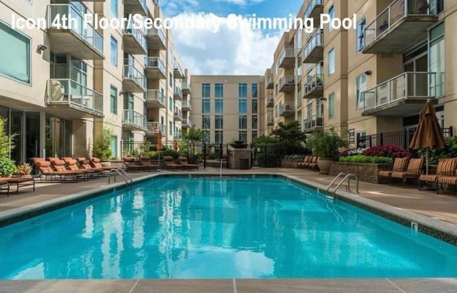 community pool featuring a patio area
