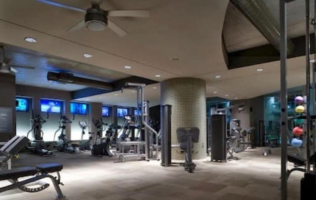 gym featuring carpet and ceiling fan