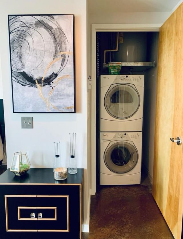 laundry room featuring stacked washer and dryer and laundry area