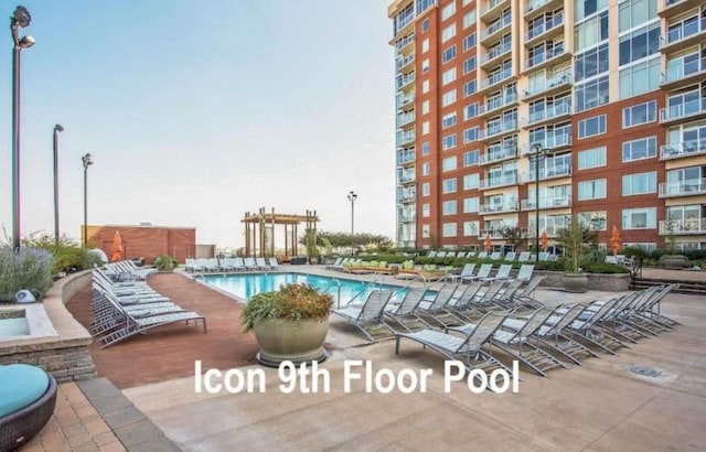 community pool with a patio area