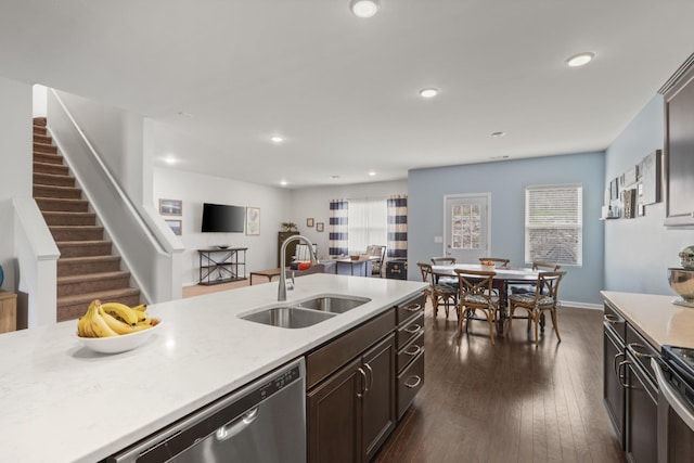 1424 Old Stone Rd NW, Lebanon, TN 37087 - kitchen with light countertops, a sink, dark wood-style floors, stainless steel appliances, and recessed lighting