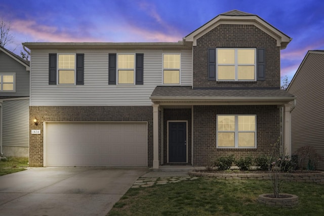 1424 Old Stone Rd NW, Lebanon, TN 37087 - view of front facade with brick siding, concrete driveway, and an attached garage