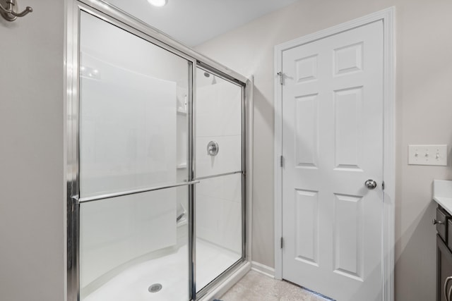 1424 Old Stone Rd NW, Lebanon, TN 37087 - bathroom featuring a stall shower, tile patterned flooring, and vanity