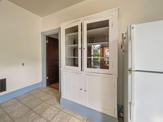 interior space featuring baseboards