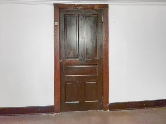 room details featuring baseboards and ornamental molding