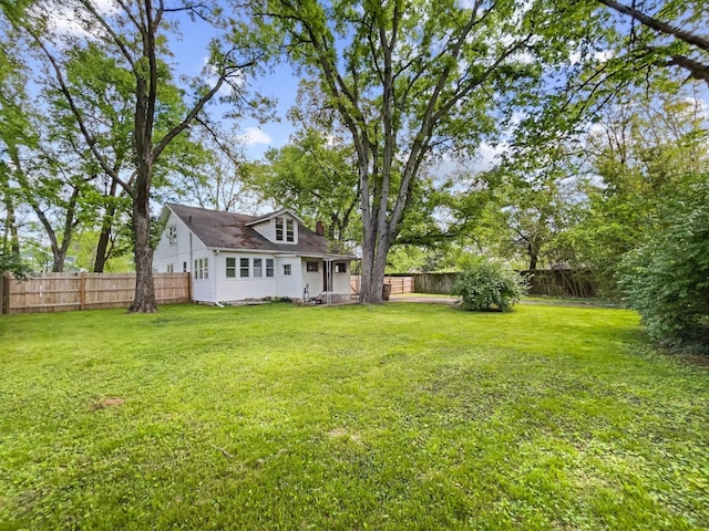 view of yard with a fenced backyard