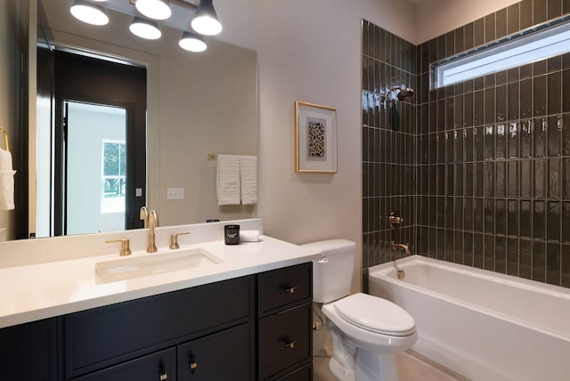 bathroom featuring toilet, vanity, and bathing tub / shower combination