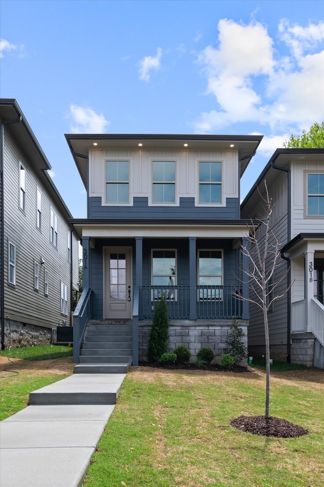 view of front of house featuring a porch and a front yard