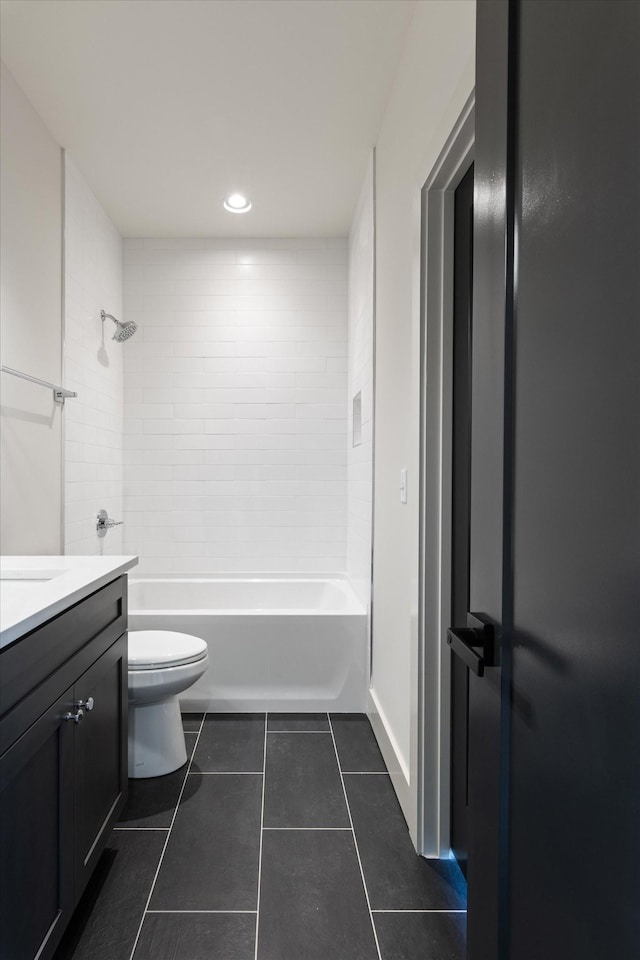 full bathroom with tile patterned floors, toilet, recessed lighting, washtub / shower combination, and vanity