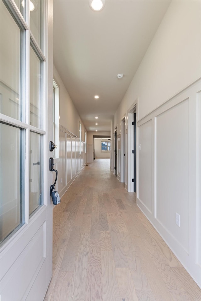 hall featuring recessed lighting and light wood-style flooring