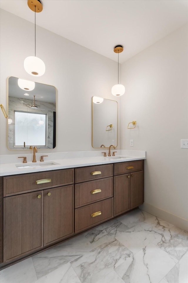 full bathroom featuring marble finish floor, a sink, and double vanity