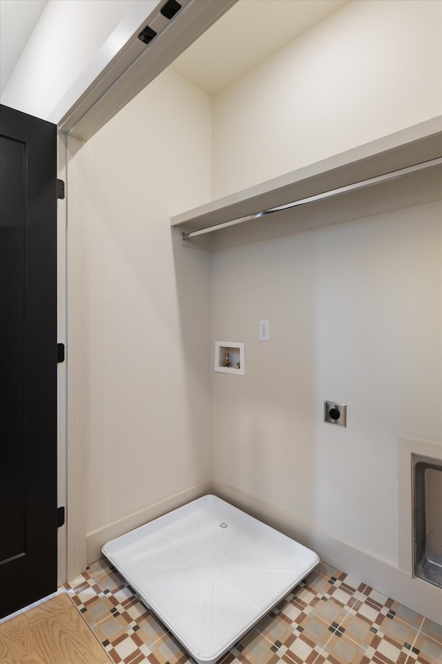 washroom featuring light floors, electric dryer hookup, hookup for a washing machine, and laundry area