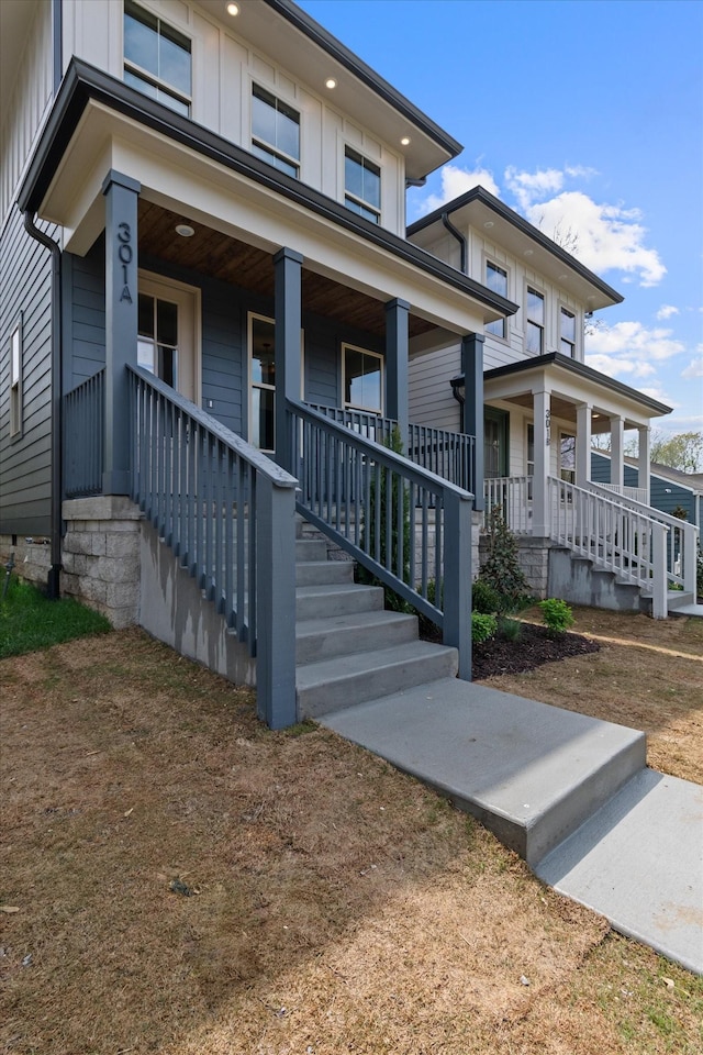 view of front of home featuring board and batten siding and covered porch