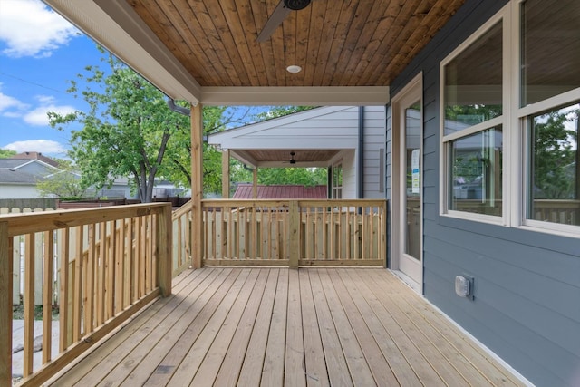 wooden terrace featuring ceiling fan