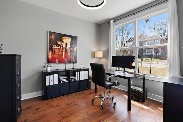 office area featuring baseboards and wood finished floors