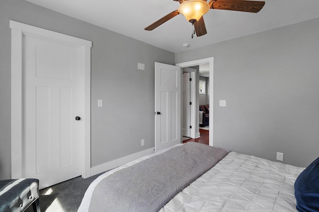 carpeted bedroom featuring ceiling fan