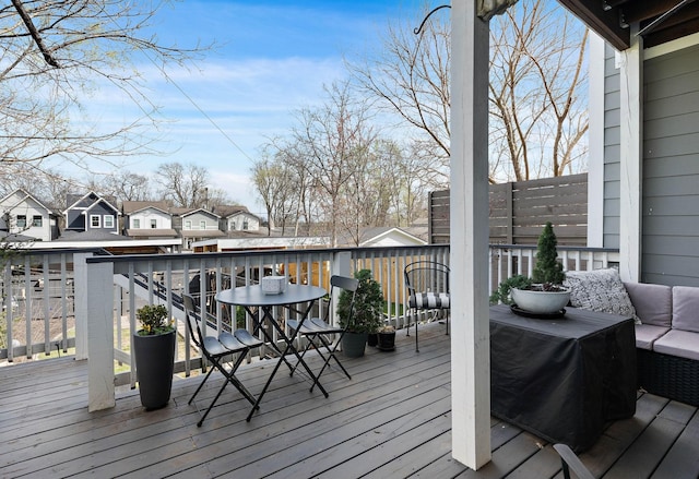 wooden deck with a residential view