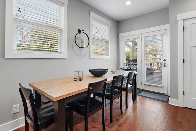 dining room featuring baseboards, dark wood-style floors, and recessed lighting
