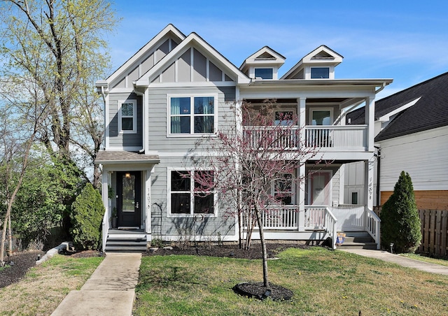 view of front facade featuring a front lawn, a balcony, and a porch