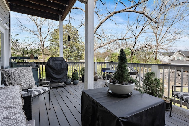 wooden terrace featuring grilling area