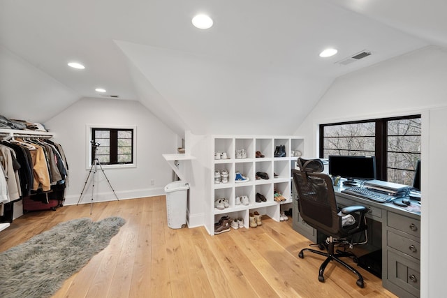 office area featuring light wood-style flooring, recessed lighting, vaulted ceiling, and visible vents
