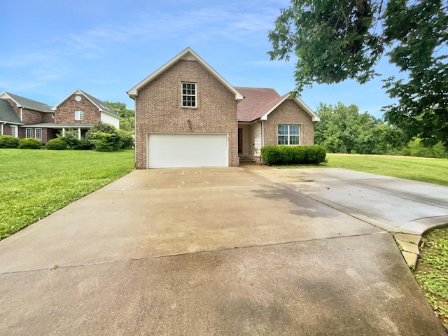 851 Salem Rd, Clarksville, TN 37040 - traditional home with brick siding, an attached garage, driveway, and a front yard