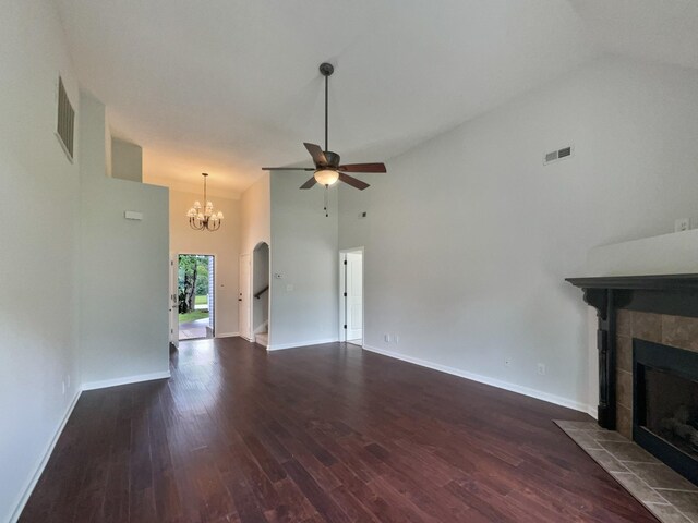 851 Salem Rd, Clarksville, TN 37040 - unfurnished living room with a tiled fireplace, a ceiling fan, dark wood finished floors, baseboards, and high vaulted ceiling
