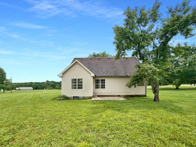 851 Salem Rd, Clarksville, TN 37040 - rear view of house with a patio, a lawn, and roof with shingles