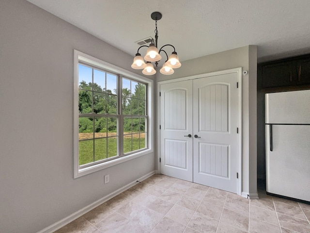 851 Salem Rd, Clarksville, TN 37040 - unfurnished dining area with a chandelier and baseboards