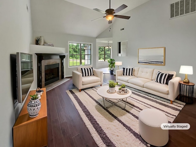 851 Salem Rd, Clarksville, TN 37040 - living room with wood finished floors, a ceiling fan, a tile fireplace, and high vaulted ceiling