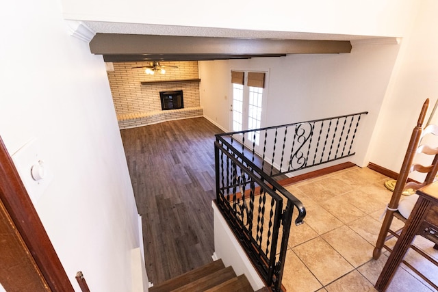 251 Sailboat Dr, Nashville, TN 37217 - stairs featuring a fireplace, baseboards, tile patterned flooring, and ornamental molding