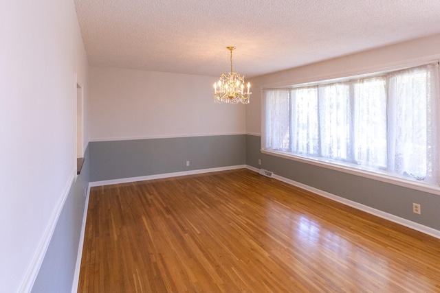 251 Sailboat Dr, Nashville, TN 37217 - spare room featuring wood finished floors, a chandelier, and a textured ceiling