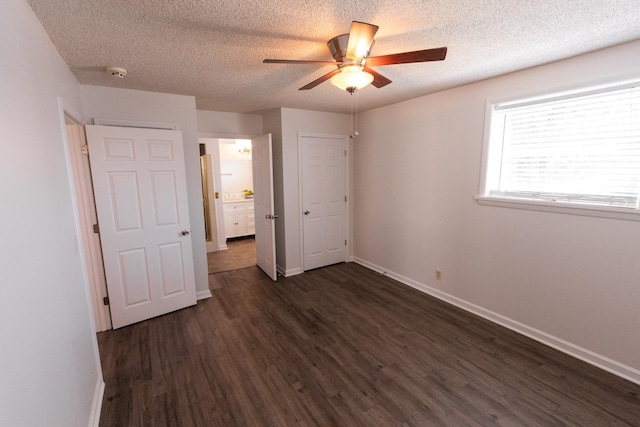 251 Sailboat Dr, Nashville, TN 37217 - unfurnished bedroom featuring dark wood-style flooring, baseboards, a textured ceiling, and ceiling fan