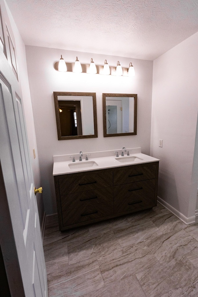 251 Sailboat Dr, Nashville, TN 37217 - full bathroom with double vanity, baseboards, and a textured ceiling