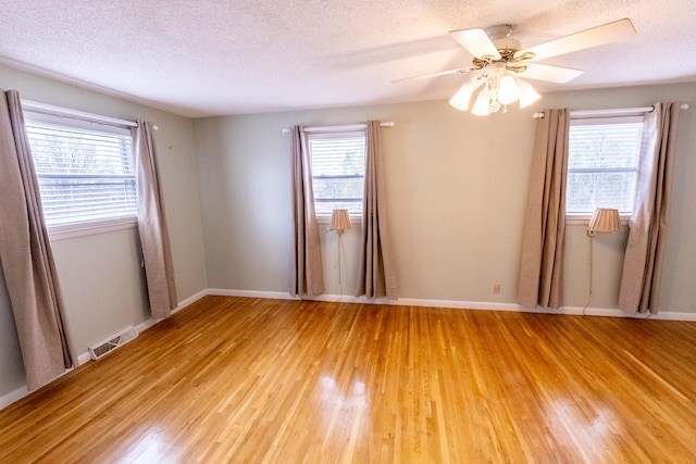 251 Sailboat Dr, Nashville, TN 37217 - empty room featuring light wood-style floors, ceiling fan, baseboards, and a textured ceiling