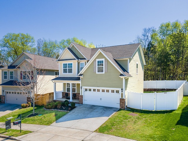 2037 Hamilton Hill Dr, Antioch, TN 37013 - craftsman house with an attached garage, a front yard, fence, and driveway