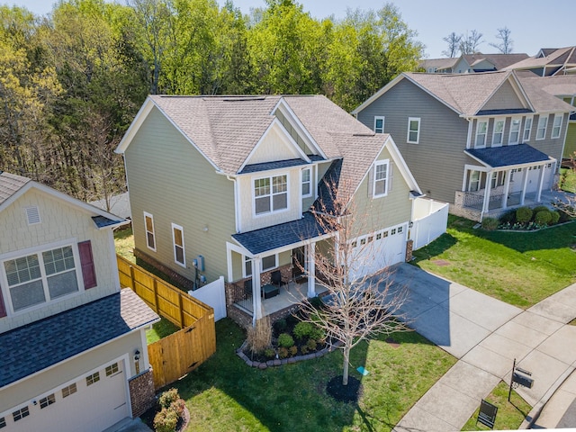 2037 Hamilton Hill Dr, Antioch, TN 37013 - traditional-style home featuring an attached garage, a shingled roof, fence, and concrete driveway
