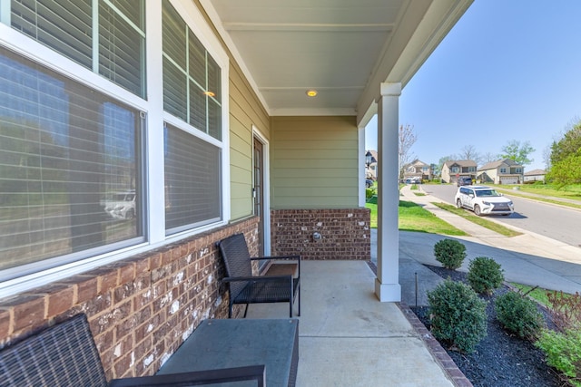 2037 Hamilton Hill Dr, Antioch, TN 37013 - view of patio featuring a porch and a residential view