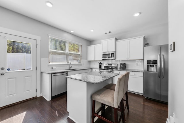 2037 Hamilton Hill Dr, Antioch, TN 37013 - kitchen featuring stainless steel appliances, a center island, a sink, and a healthy amount of sunlight