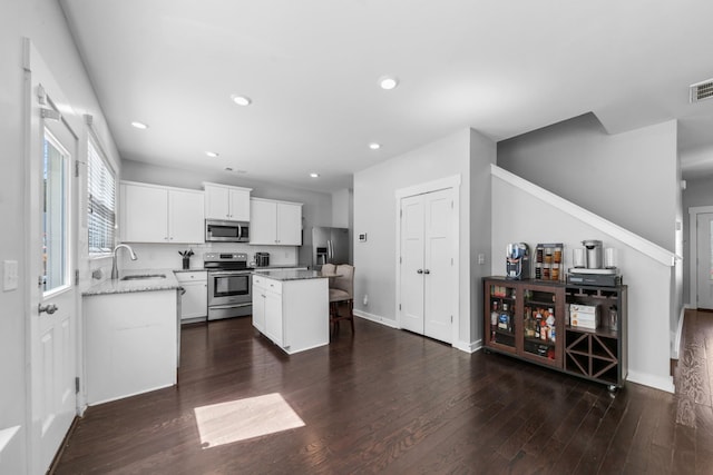 2037 Hamilton Hill Dr, Antioch, TN 37013 - kitchen with a sink, stainless steel appliances, dark wood-type flooring, a kitchen island, and recessed lighting