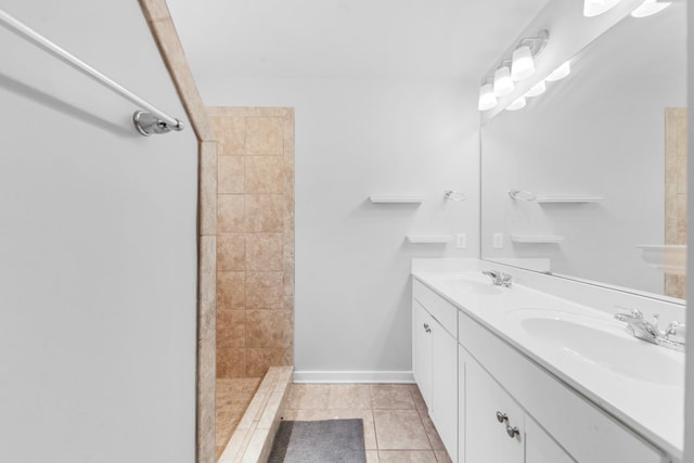 2037 Hamilton Hill Dr, Antioch, TN 37013 - bathroom featuring double vanity, tile patterned flooring, tiled shower, and a sink
