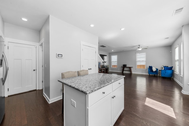2037 Hamilton Hill Dr, Antioch, TN 37013 - kitchen with a kitchen island, visible vents, a ceiling fan, and dark wood-style flooring