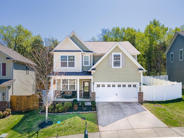 2037 Hamilton Hill Dr, Antioch, TN 37013 - craftsman-style home with a garage, driveway, a front yard, and covered porch