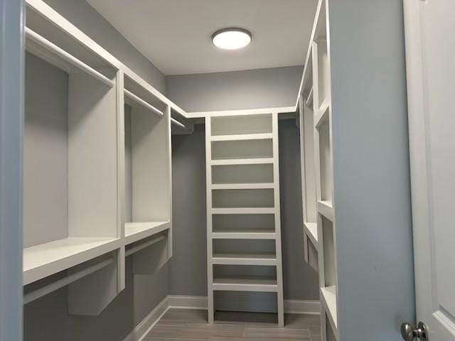 spacious closet with wood finished floors