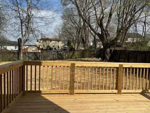 deck with a fenced backyard