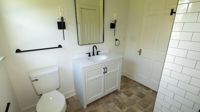 259 W End Hts, Lebanon, TN 37087 - bathroom with toilet, baseboards, stone finish floor, and vanity