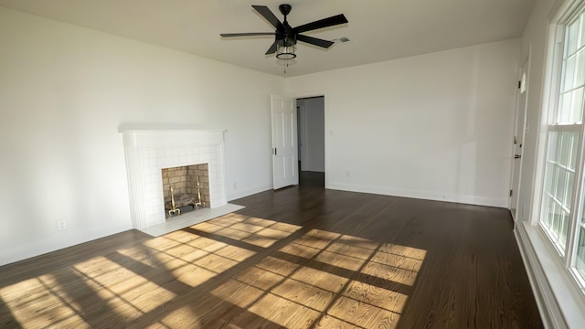 259 W End Hts, Lebanon, TN 37087 - unfurnished living room featuring baseboards, a brick fireplace, dark wood-style flooring, and a wealth of natural light