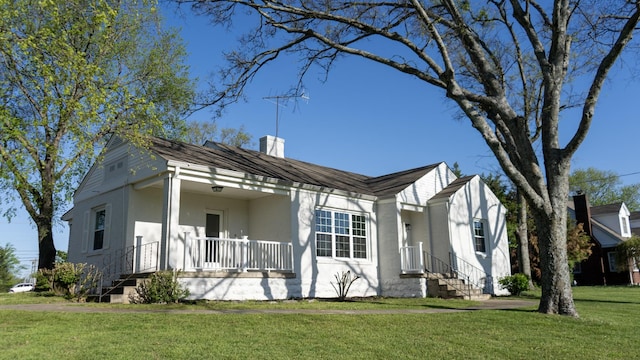 259 W End Hts, Lebanon, TN 37087 - view of front of home with a chimney, stucco siding, and a front yard