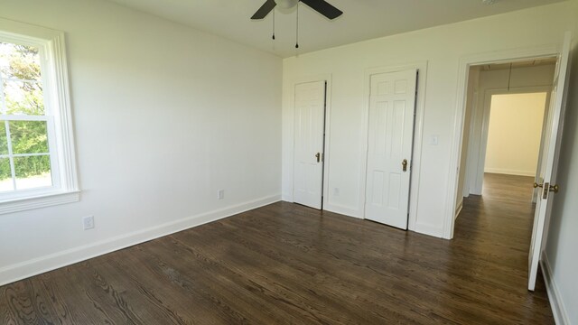 259 W End Hts, Lebanon, TN 37087 - unfurnished bedroom with baseboards, a ceiling fan, attic access, and dark wood-type flooring