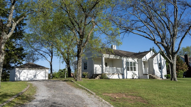 259 W End Hts, Lebanon, TN 37087 - view of front of property featuring covered porch, a detached garage, a front yard, an outdoor structure, and driveway